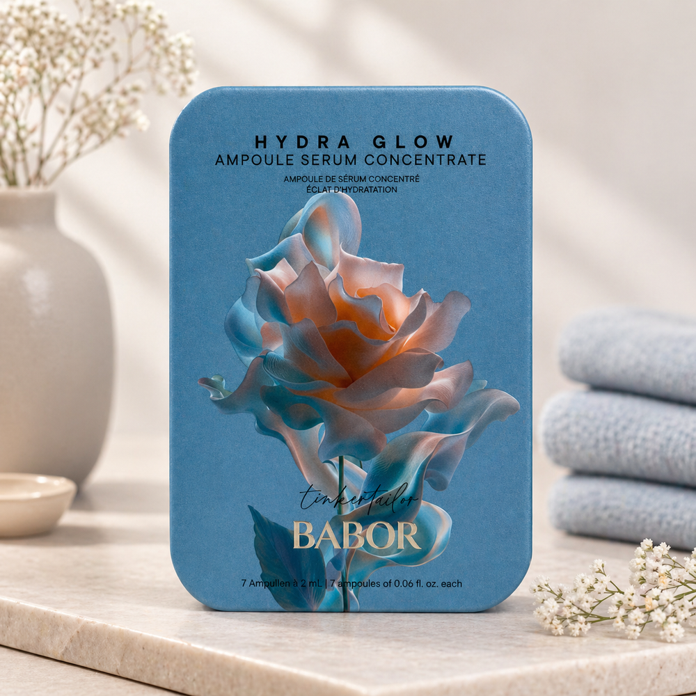Babor Hydra Glow Ampoule Serum Concentrate packaging with a rose design on a blurred background
